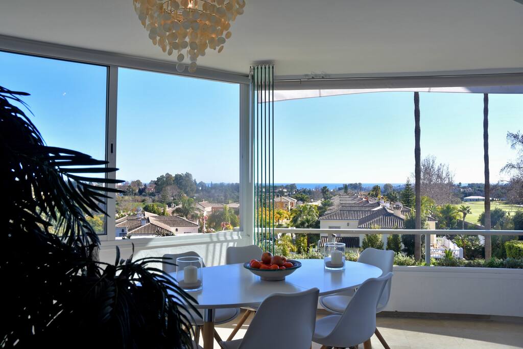 Dining area. In the summer you can open the glass curtains and eat alfresco. Lovely breeze in the summer.