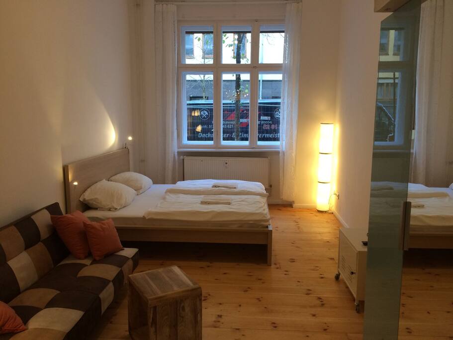 Room with double bed and bed sofa