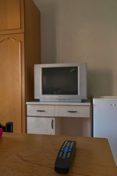 Storage space, fridge and cable TV.