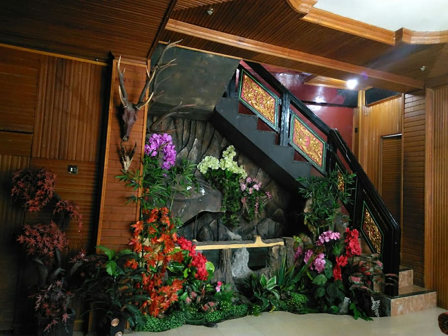 Beautiful living room with flower garden n fish pond
