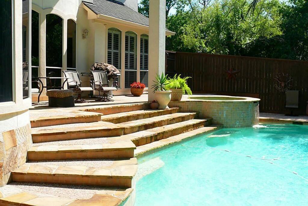 Resort style heated salt water pool and hot tub area