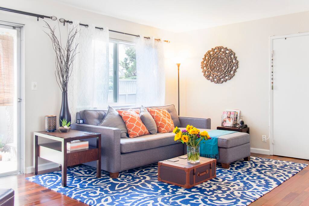 Comfy sectional couch with chaise on one side for lounging and napping.