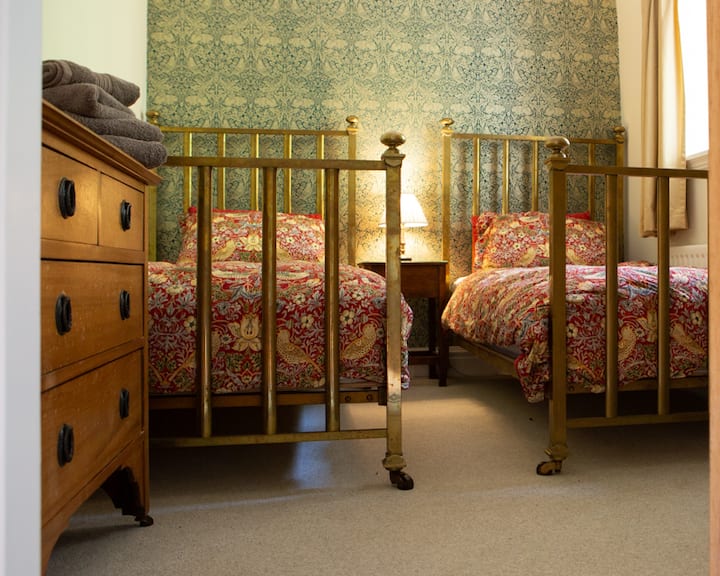 Twin brass beds in the second bedroom