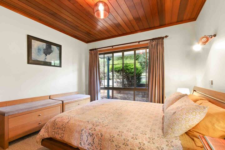 Bedroom 2 with queen size bed, wardrobe and luggage rack's. 