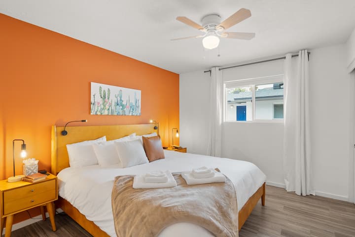 The huge bedroom offers a very comfortable king-sized Tuft & Needle mattress with lots of pillows and a cozy blanket. Reading lights mounted to the bed, USB chargers on both night stands, and blackout curtains finish the room. 