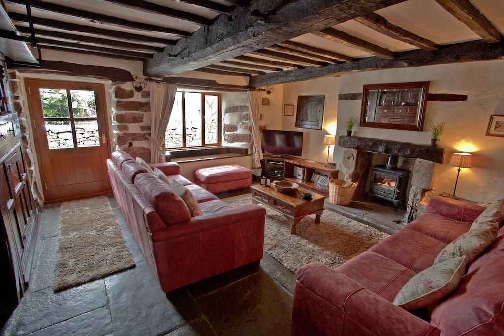 The Farmhouse Oak Beamed Dining Room with wood burning stove