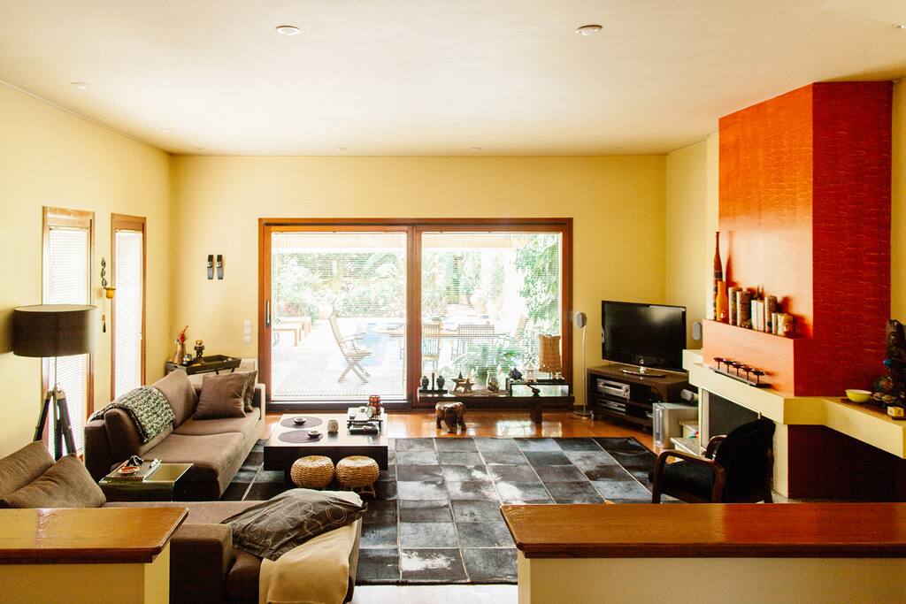 The living room, overlooking the garden and pool