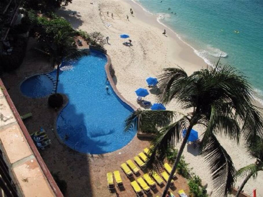 One of our pools and beach taken from our balcony.