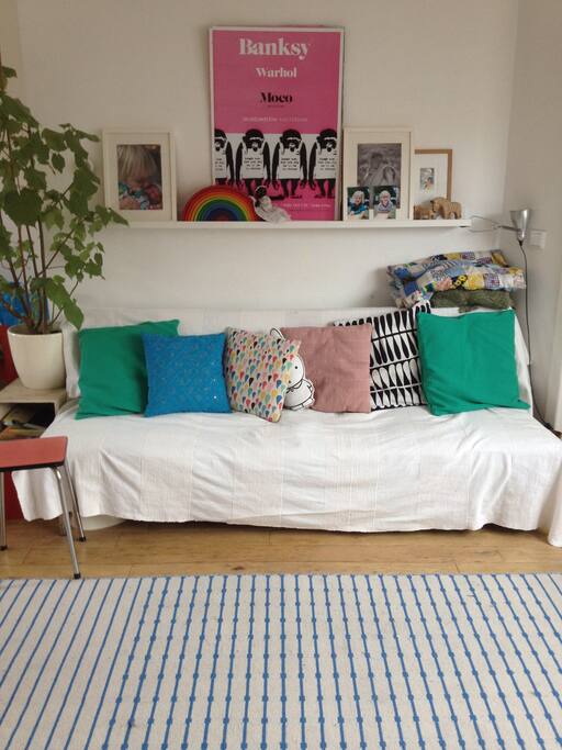 Light and sunny living room, with comfortable couch that can be transformed into a bed