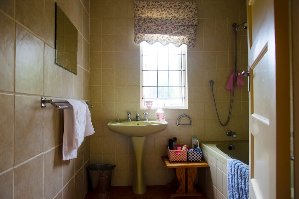 a nice clean bathroom for guest use complete with bath and shower mechanism
