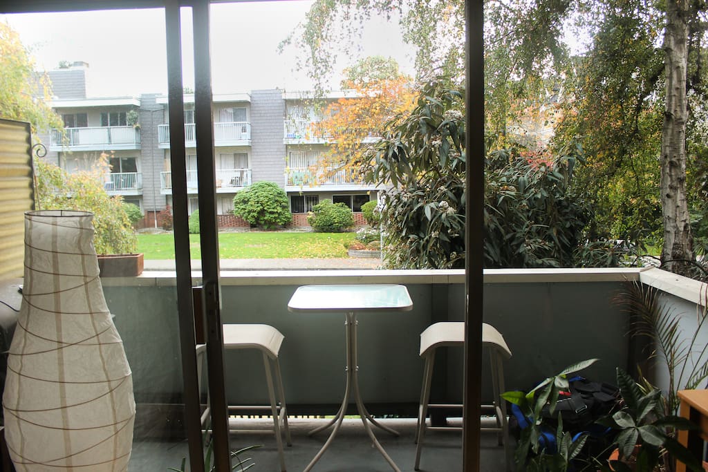 Balcony with tree'd view.