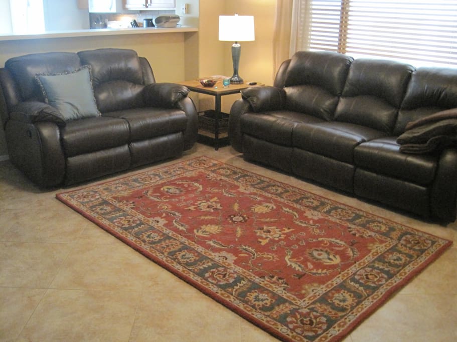 Great Room with Reclining Leather Sofas, and a 55" flat screen tv offer casual comfort.