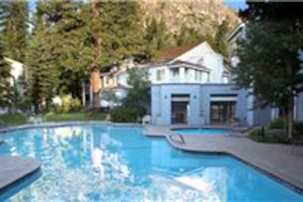 Two outdoor hot tubs and a pool.