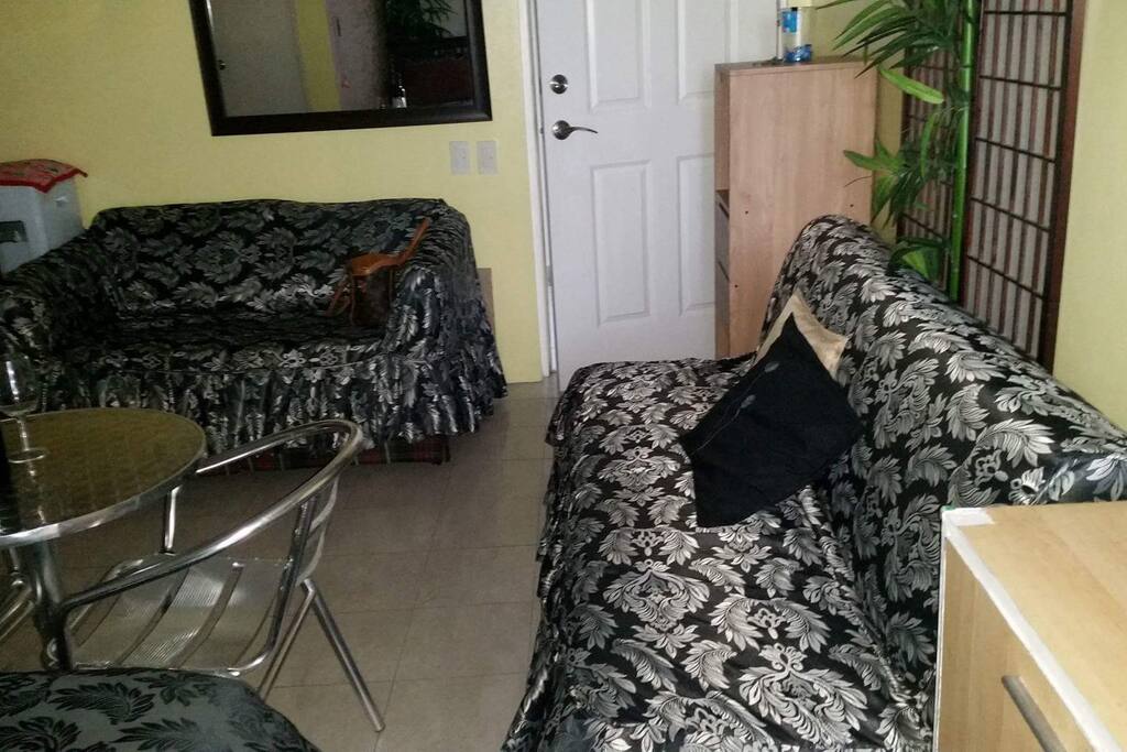 With 2 sofa bed. The long one on the right is good for 2 persons. The one on the left is for one person.