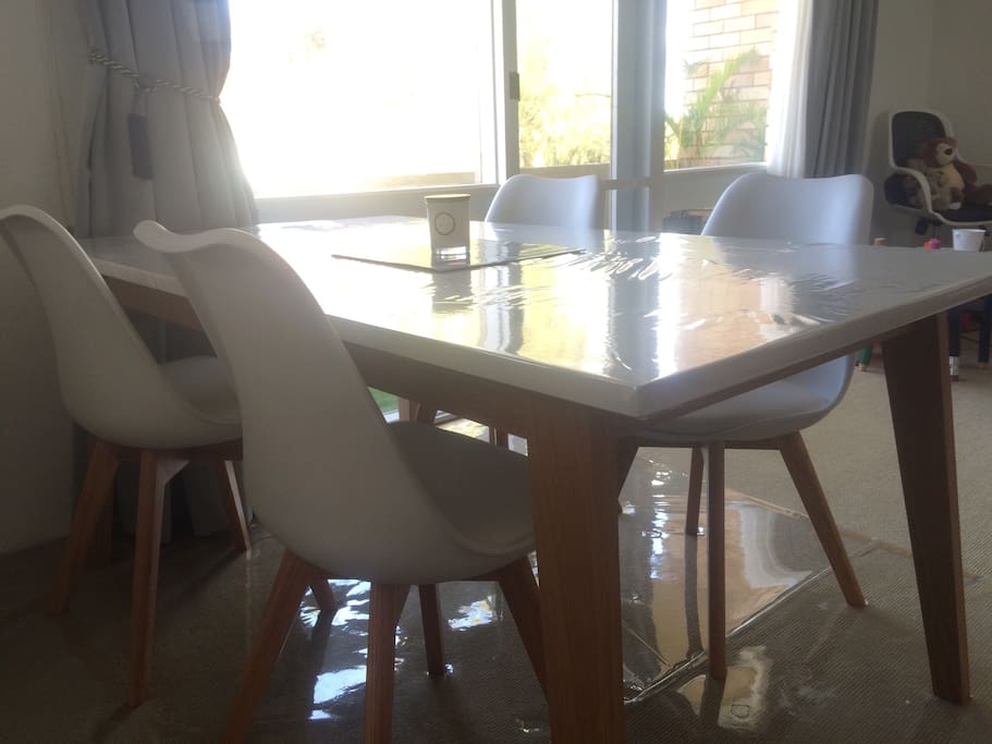 Brand new dining table & four chairs.
