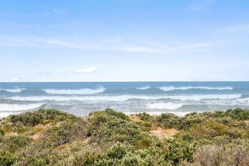 View across the dunes to the waves