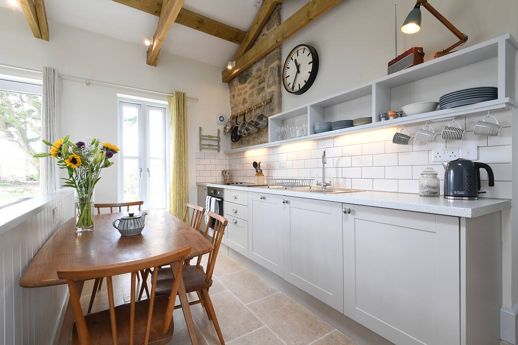 Kitchen with halogen hob & fan oven, integrated dish washer and fridge. There is also a washing machine and a bread machine