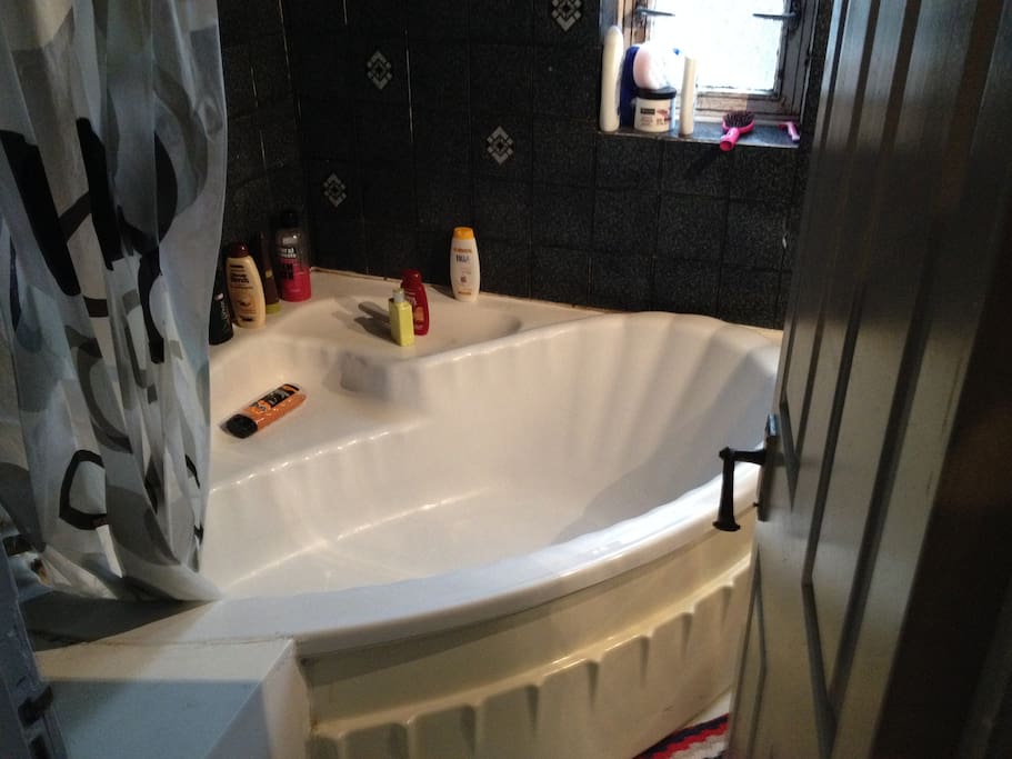 bathroom with big bath