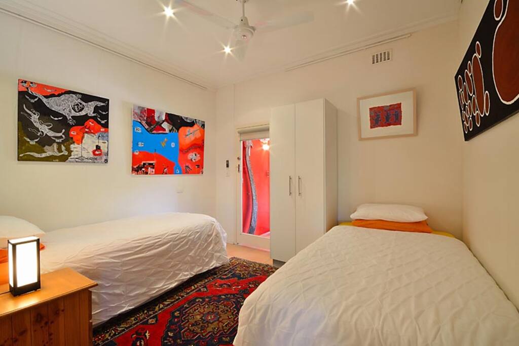Two single beds that open out to the back patio.
