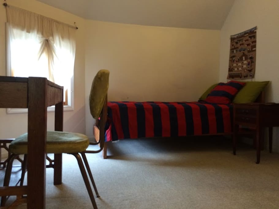 Tower room located on the 3rd floor. Single bed for those seeking simple but comfortable accommodations.