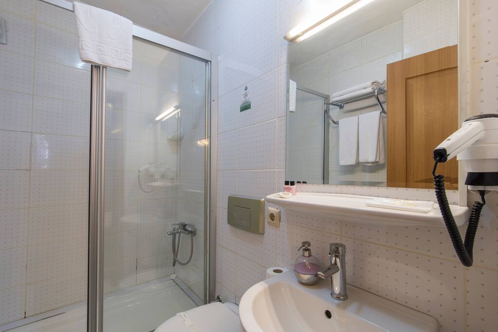 Spacious bathrooms with cabin shower. Complimentary soap, shampoo, slippers, towels, hair-dryer.