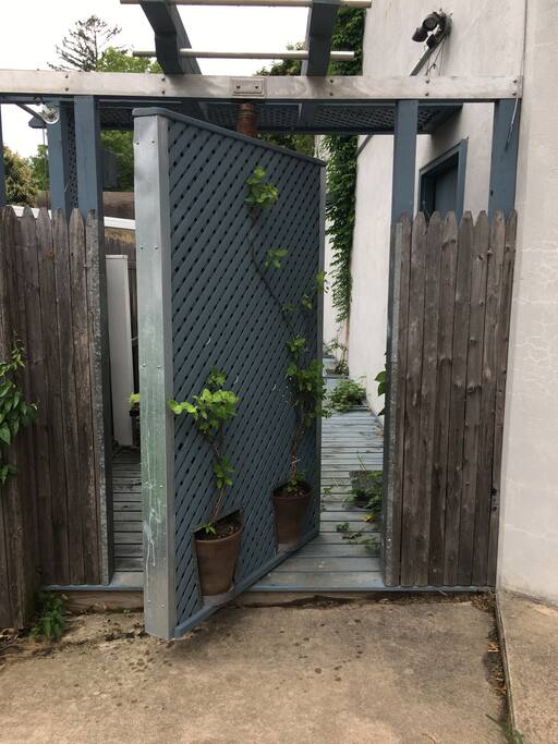 Rotate gate door to enter patio.