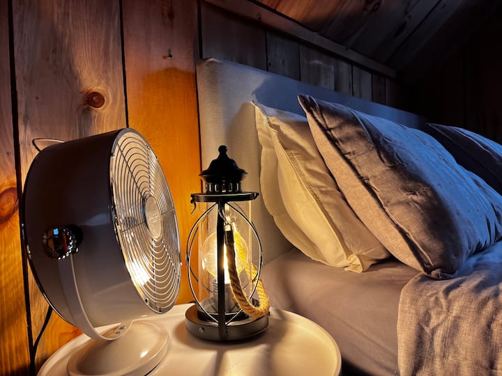 Cozy room with queen bed on the open mezzanine