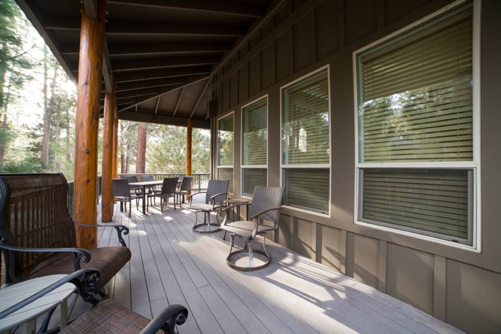 Wrap around covered deck with dining for 10, two sets of cafe tables and chairs