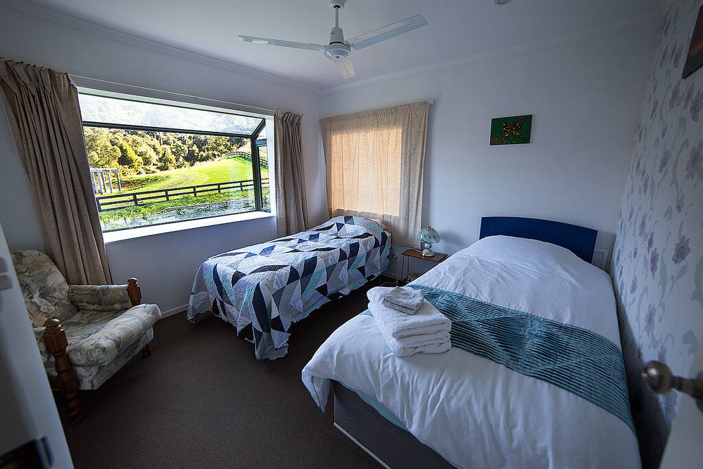King single (2.3 m long) and single roll out bed plus armchair