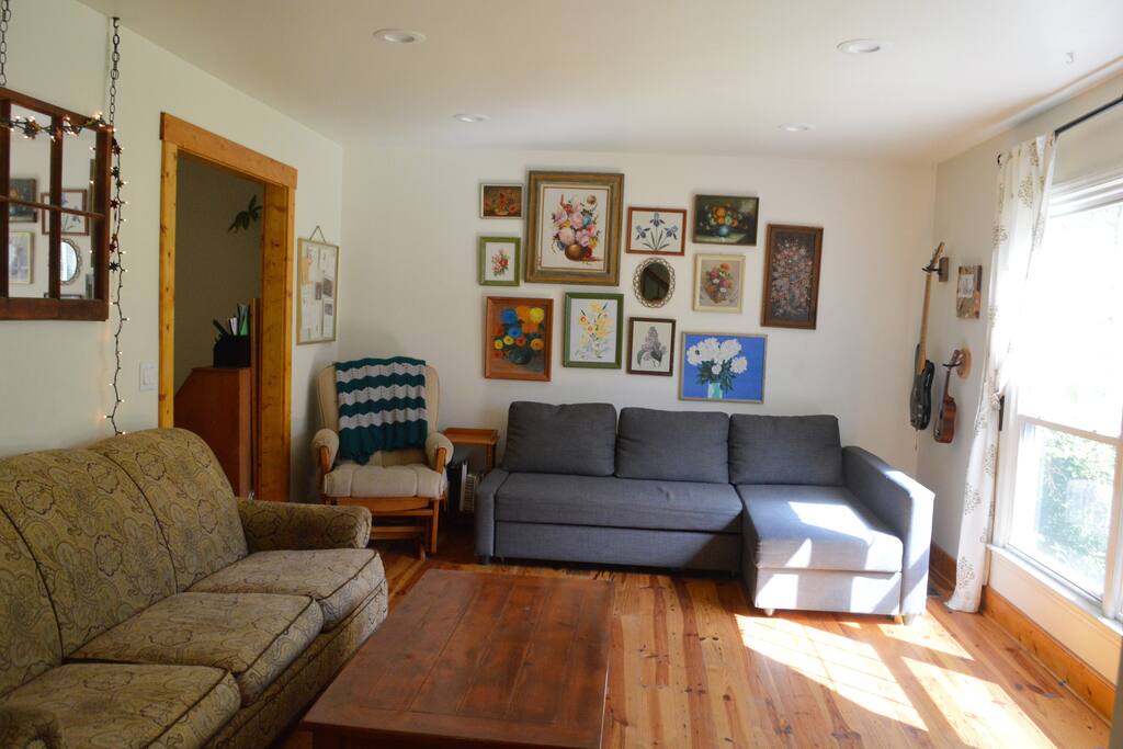 Light-filled living room with plenty of seating and pullout sofa