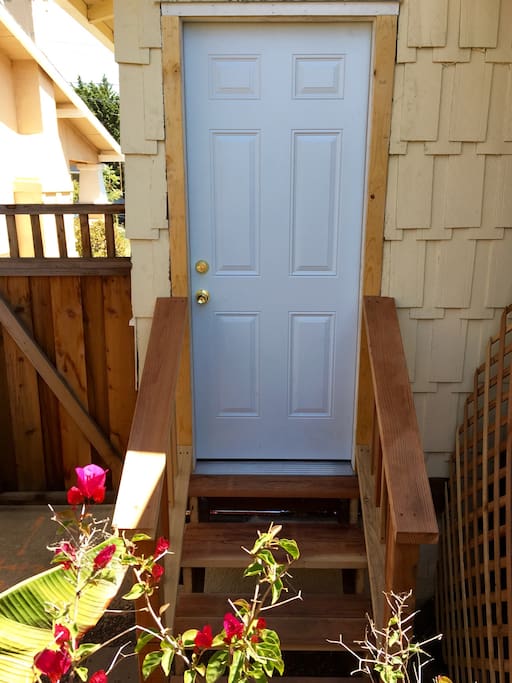 Entrance to private suite. Small seating area to the left.