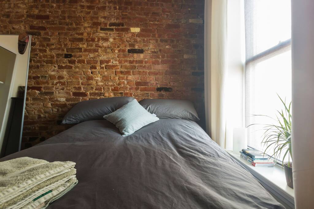 We've continued to upgrade the room since this photo was taken (extra lamp, curtains, big squashy pillows etc.) but this shows how livable the room is - there's a closet as well just out of sight.