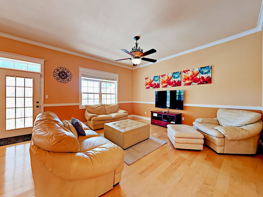 The spacious living room has ample seating. Relax and browse the TurnKey HomeDroid tablet (an electronic guest directory with helpful household information and area suggestions).