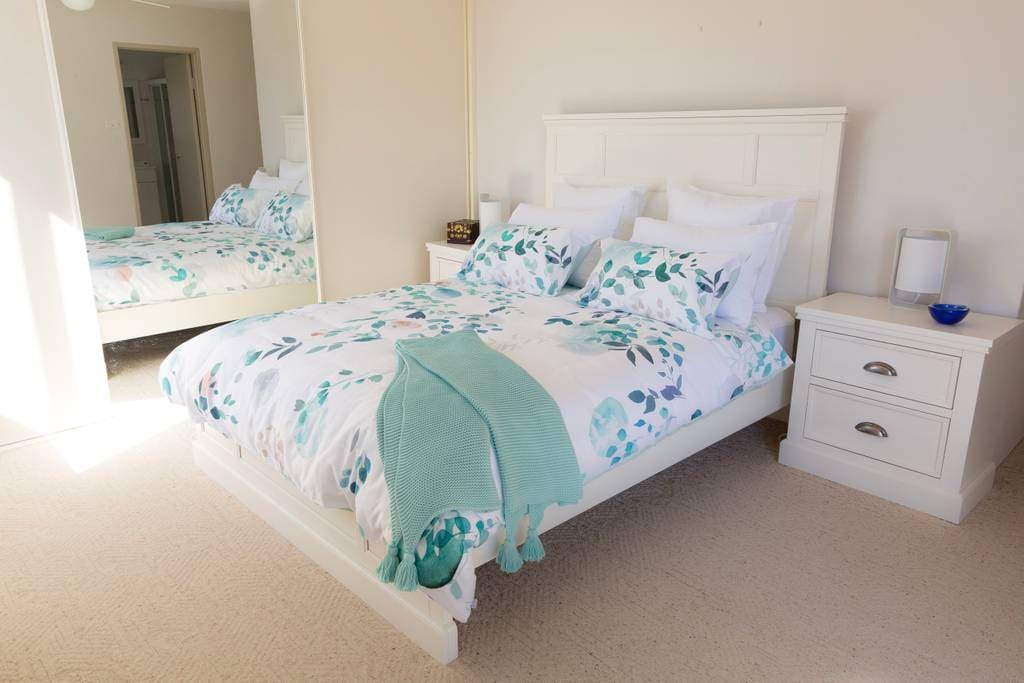 Master bedroom with en-suite and ceiling fan