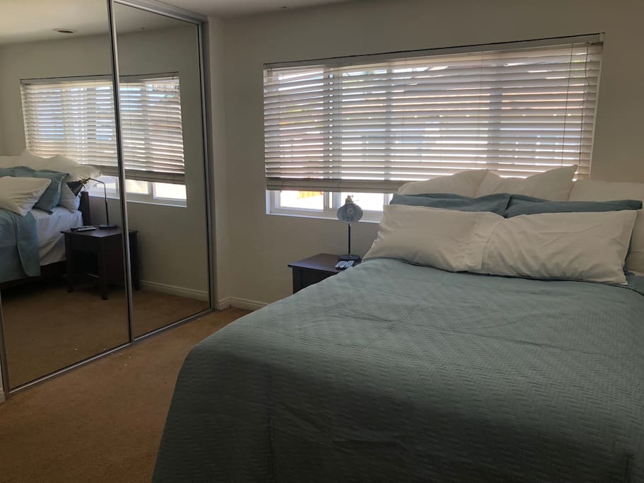 Bedroom with queen bed, TV with cable, attached private bathroom.