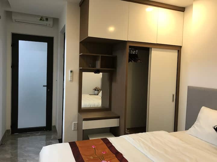 Main bedroom with closet, great aircon, makeup table, hangers