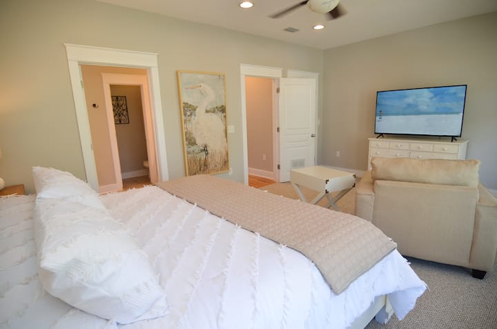 Second floor primary bedroom suite with plush king bed