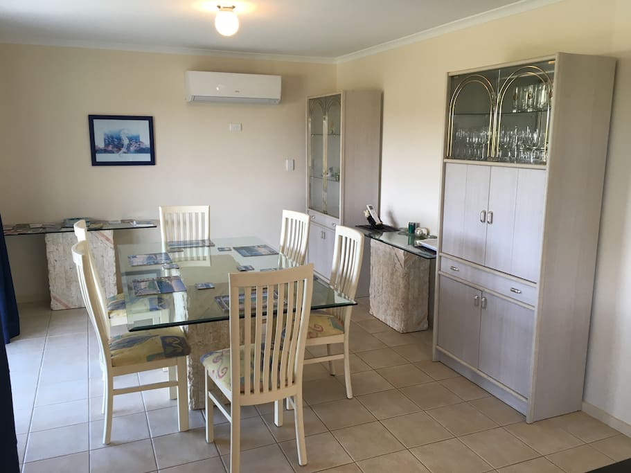 Dining area including 6-seat table setting & glass cabinet