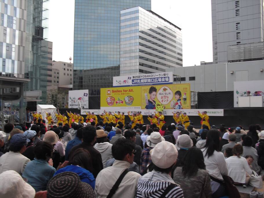 If you want to go straight to my HOUSE by bus from Sapporo station, there you must find its south exit (minami guchi; 南口). When you go out from it, you see several high buildings (photo), sometimes you can see an amusement such as YOSAKOI dance (photo).