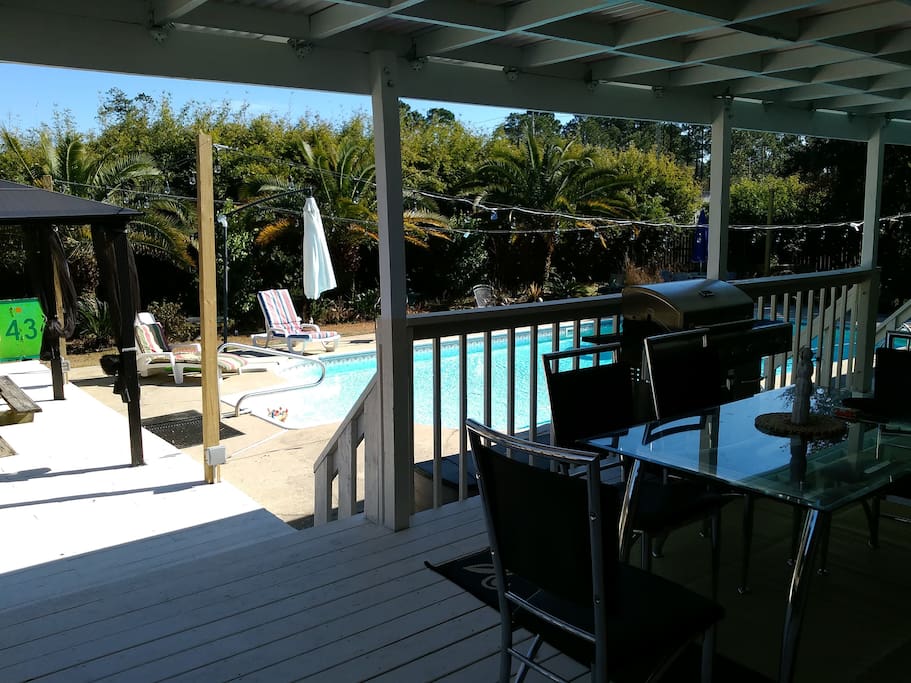 View from covered deck towards pool.
