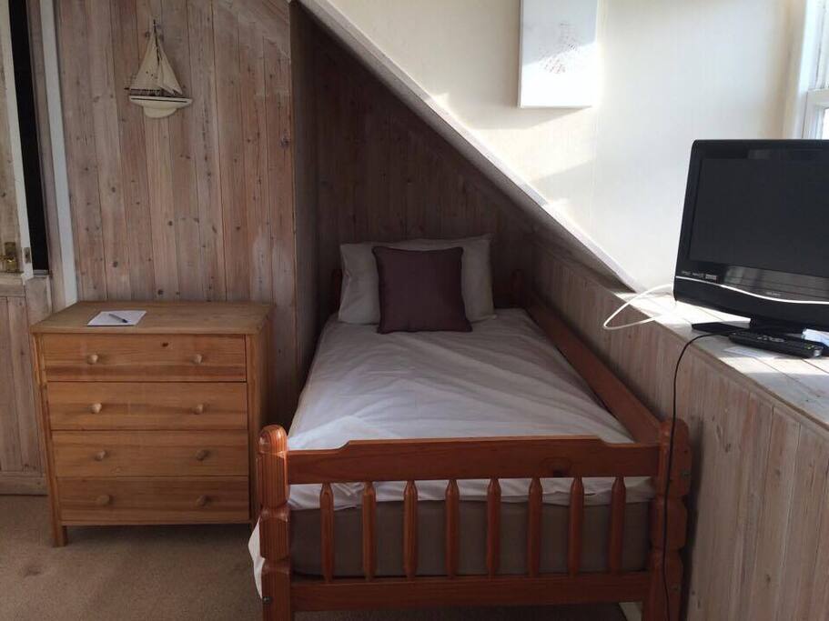 Room 12 - Quad room with sea view and small ensuite shower room. 1 x double & 2 x singles.