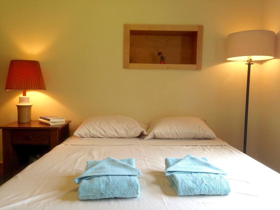 The guest room has a queen bed with medium-firm memory foam, and some neat built-in storage places.
