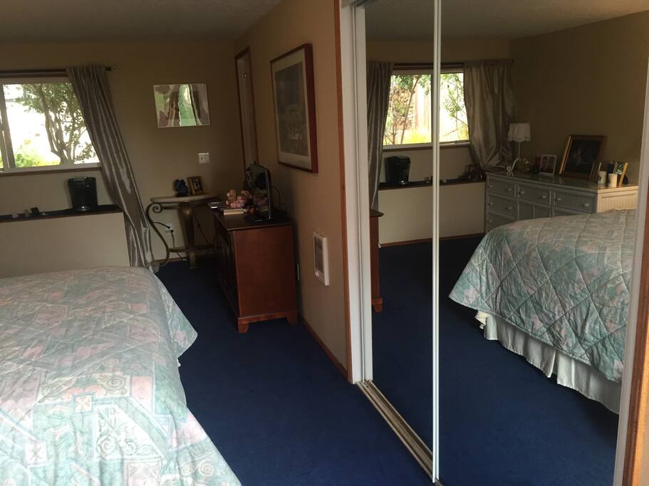 Mirror closet, door on left right corner into the hallway to shared bathroom & a separate room with dishes, microwave, counter top and sink