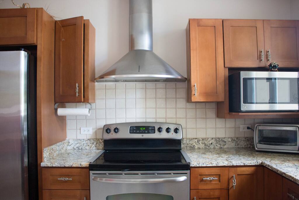 Fully equipped kitchen includes dishwasher and coffee maker.