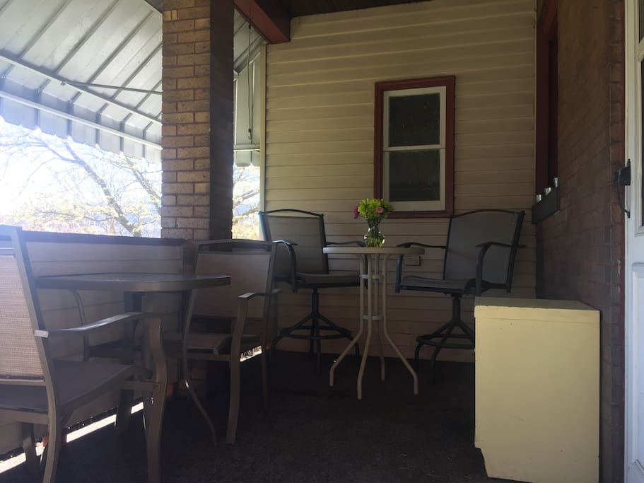 Covered porch in both the front and back yard