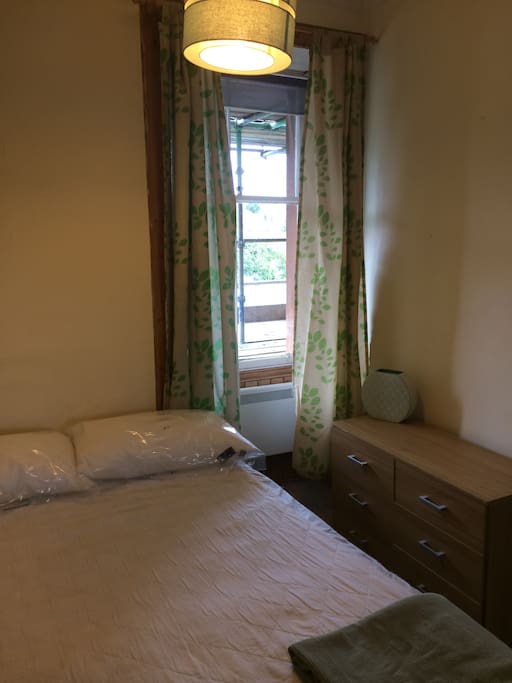Bright, clean bedroom with double bed. Built in mirrored cupboards = excellent storage