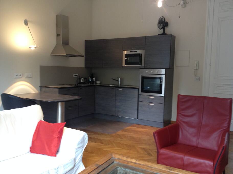 kitchen with table, coffee machine, freezer, ... all in