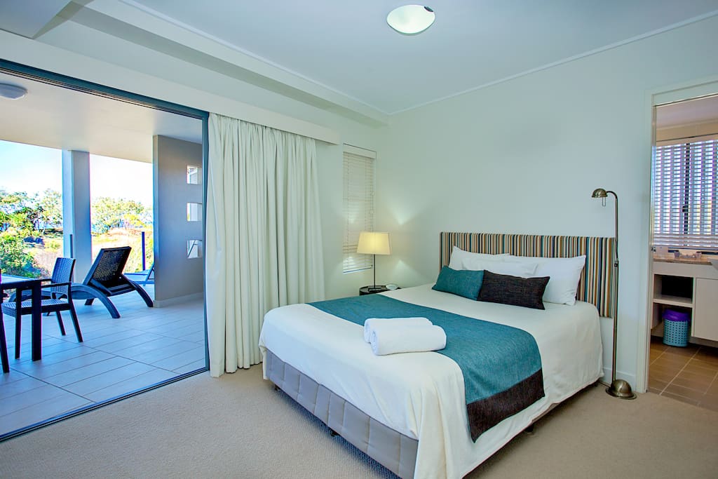 Large master bedroom with ensuite and balcony looking over the beachfront