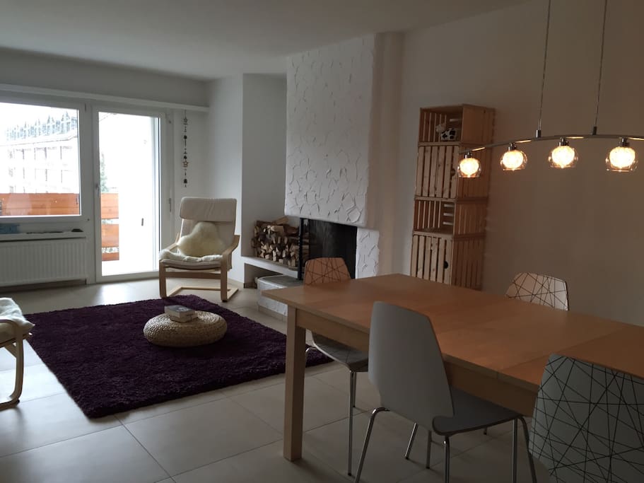 Spacious living room with dinner table (max 9) seating area and cozy cheminee