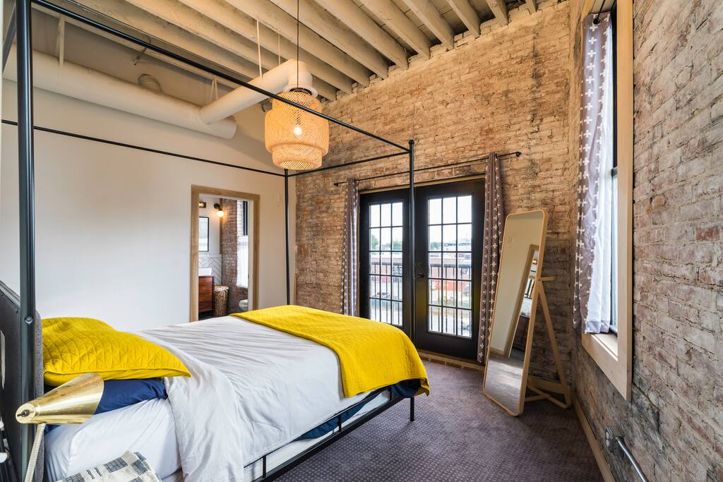 The master bedroom is simple and light filled.